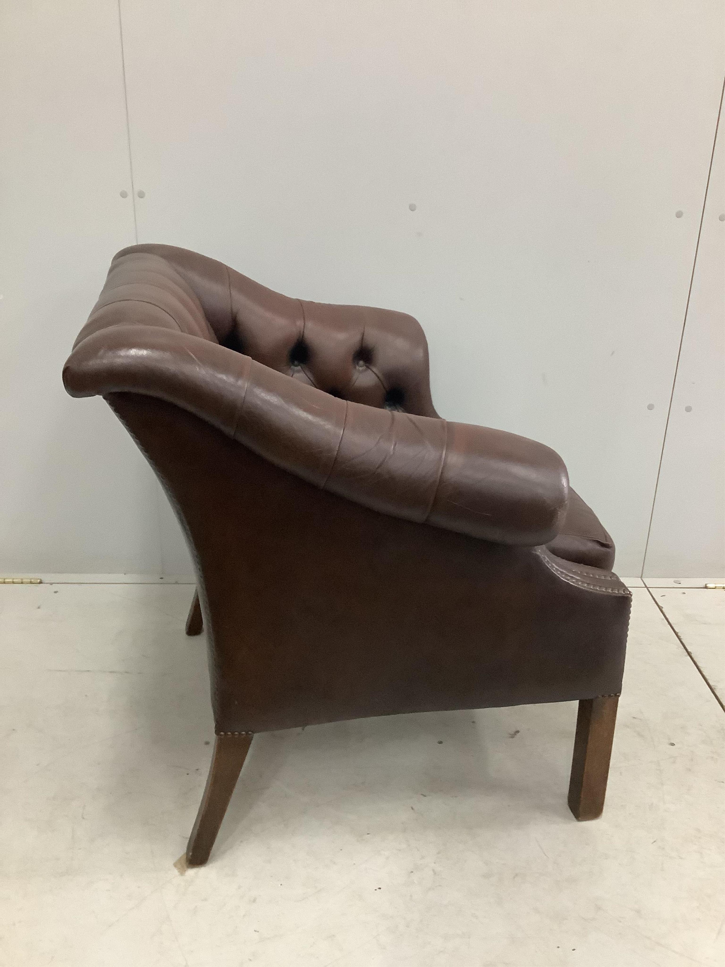 A George III style buttoned brown leather club chair, width 90cm, depth 76cm, height 82cm. Condition - fair